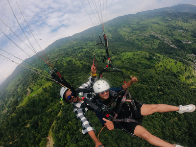 Paragliding above the green hills of Pokhara